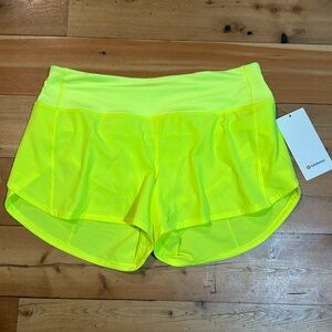Medium Rise - Speed Up Shorts - Lined
4in inseam 
Size 10
Brand New